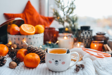 Cute cup of hot steaming tea in the New Year atmosphere, aesthetic photo