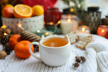Obraz na płótnie Canvas Cute cup of tea in New Year's decor, cozy photo