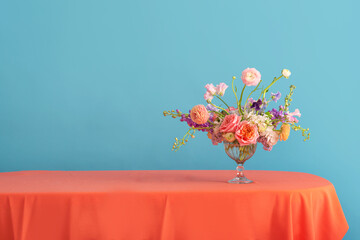 Flower decoration in a glass vase, pastel colors 