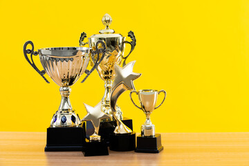 Group of trophies on wooden table
