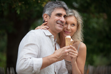 senior couple eating an ice cream