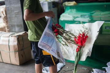 flower vendor packing the sold flower