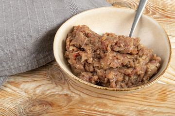 Minced Meat Mix in Round Bowl, Ground Pork, Turkey, Beef and Chicken Meat with Onion and Black Pepper