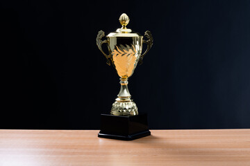 Golden trophy cup on the table