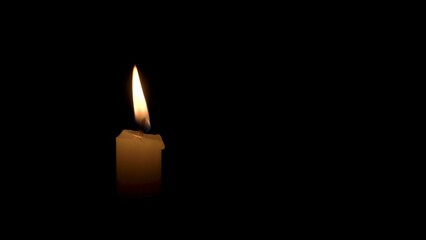 A Candle Burns with a Bright Flame on a Black Background. The Flame of a Wax Candle Glows Mysteriously in the Darkness. Illustration of Remembrance, Celebration or Religious Ceremony