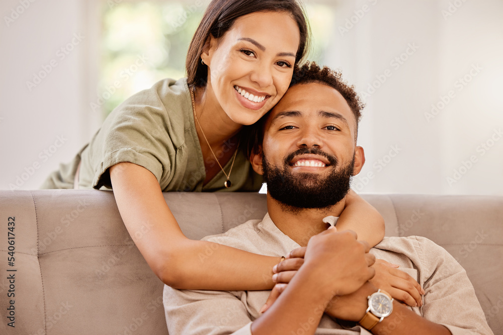 Wall mural Relax, love and portrait of couple on sofa together for happy, marriage and affectionate hug. Smile, connection and care with man and woman in living room together for relationship, peace or wellness