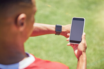 Green screen, soccer player and phone on field with smartwatch, tech or mockup on mobile digital app. Man, football player or smartphone on social media, web or 5g network at training, game or match - Powered by Adobe
