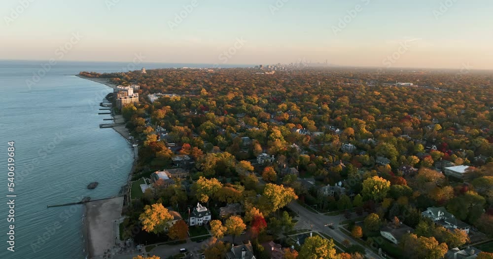 Poster aerial along lake michigan and chicago north shore suburbs, colorful autumn trees during sunset. bro