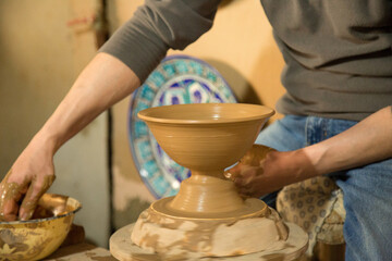 The clay bowl is made by hand in Rishtan.