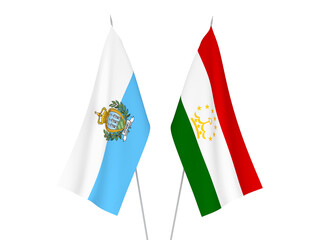 National fabric flags of Tajikistan and San Marino isolated on white background. 3d rendering illustration.