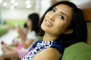 pregnant woman sitting and waiting for turn to check her baby to the doctor