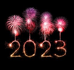 2023 happy new year fireworks celebration written sparkling at night.