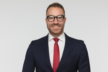 young handsome businessman smiling at the camera