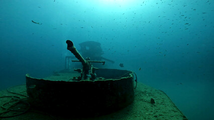 HTMS Sattakut wreck from the front side with large cannon gun - under water shot - Ko Tao island in Thailand