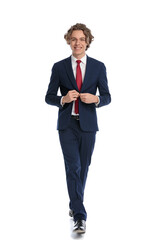 picture of happy young businessman unbuttoning and opening suit