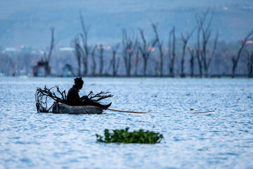 Naklejka premium Fisherman in Lake Naivasha, Kenya