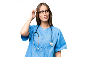Young nurse caucasian woman over isolated background having doubts and with confuse face expression