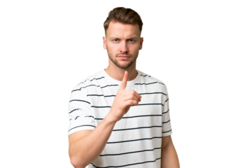 Young blonde caucasian man over isolated background frustrated and pointing to the front