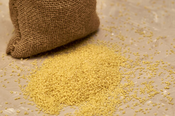 croup couscous poured out of a canvas bag on the table