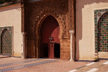 Entrance door in the Mausoleum of Moulay Ismail in Meknes in Morocco - obrazy, fototapety, plakaty