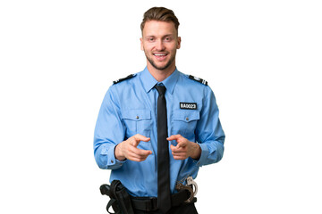 Young police man over isolated background pointing to the front and smiling