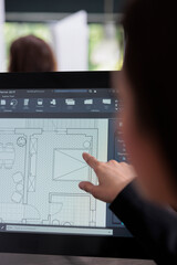 Real estate agent planning room floor in software, drafting, home interior wireframes on computer...