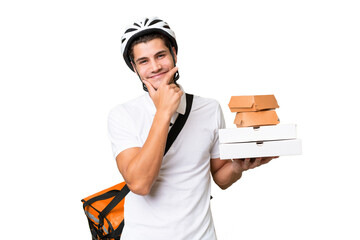 Young caucasian man with thermal backpack over isolated background happy and smiling