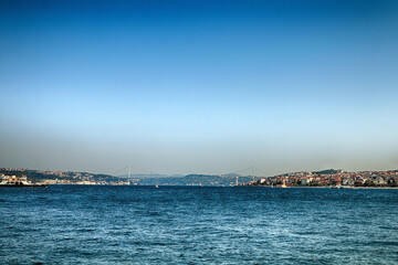 Fototapeta na wymiar Sea shore. View of the Bosphorus and bridge.
