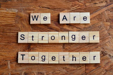 We Are Stronger Together text in wooden square, motivation quotes