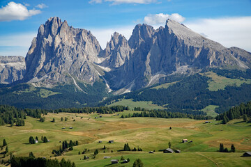 Fototapeta na wymiar Majestic mountain view in the dolomites: Distinctive Sassolungo mountain group at gardena valley in south tyrol. 
