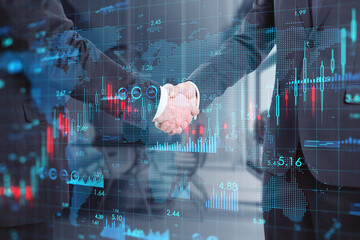 Global economy and partnership concept with digital financial chart indicators and world map on businessmen handshake background, double exposure