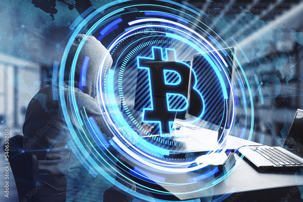 Leinwandbilder hacker hands using computers at desktop with creative glowing bitcoin hologram and map on blurry office interior background. Crytpocurrency, nft, hacking, data, metaverse and blockchain concept. 