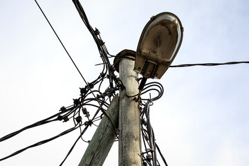 Street lighting on a pole. Electrical wires, cables and communications