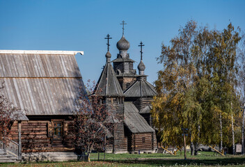 ancient architecture with elements of wooden architecture against the background of the autumn sky