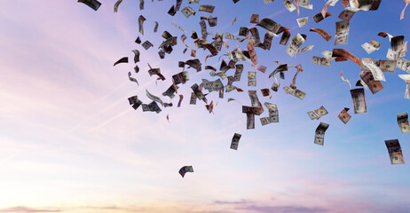 Money falling from sky - one hundred US dollar bills.