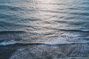 Abstract nature background, sea surface ripples waves in sunset light