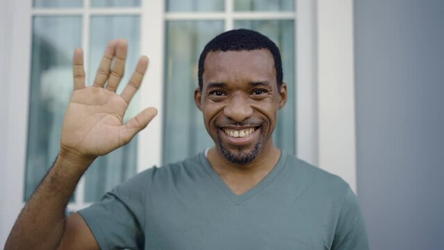 Portrait of young handsome black African man use smartphone selfie say hi in the nature park Happy afro guy online influencer blogger. Education technology connected people man lifestyle concept