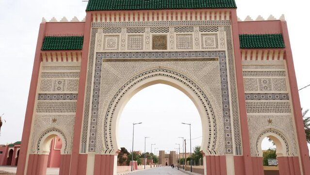 The entrance, city gate, bab, gate, door, leading into Rissani, South Morocco. Landmark and iconic touristic site of Rissani. 4k footage.