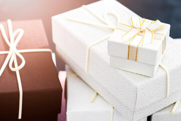 white gift boxes stacked on top of each other.