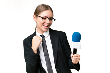 Naklejka premium Young TV presenter caucasian woman over isolated background celebrating a victory