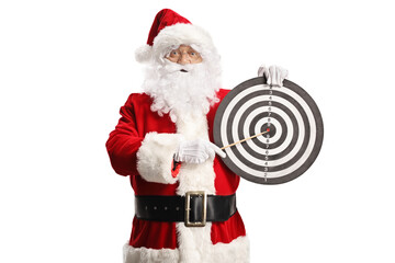 Santa claus holding a dart target board and pointing with a stick