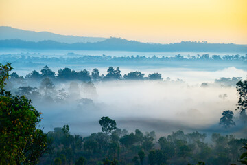 Aerial view sunrise over mountain with fog over the ground in foreground savannah Meadow , Petchaboon province, Thailand,asia.
