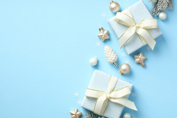 Christmas gifts and decorations on pastel blue background. Xmas card, New Year banner design.