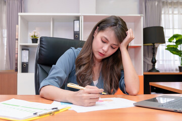 Business woman working in office with documents