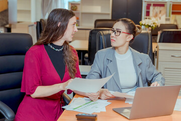 Obraz premium Finance,accounting,Businesswomen analyzing investment charts with calculator laptop calculate technology in office, marketing business analysis data concept