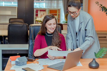 Finance,accounting,Businesswomen analyzing investment charts with calculator laptop calculate technology in office, marketing business analysis data concept