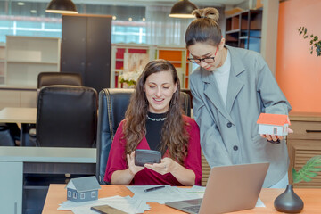 Finance,accounting,Businesswomen analyzing investment charts with calculator laptop calculate technology in office, marketing business analysis data concept