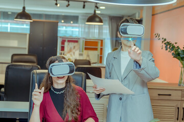 Business woman wearing virtual reality goggles touching air communicate online during vr meeting...