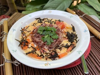 Brown rices and egg mixed tomato stir fried with soy and sesame sauce