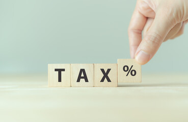 TAX concept, on wooden block. Including of state taxes,tax payment, governant ,calculating finance, tax accounting, statistics and data analytic reserach, calculation tax return, strategy plan, report